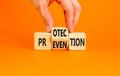 Protection and prevention symbol. Concept word Protection Prevention on wooden cubes. Businessman hand. Beautiful orange table Royalty Free Stock Photo