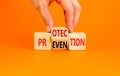 Protection and prevention symbol. Concept word Protection Prevention on wooden cubes. Businessman hand. Beautiful orange table Royalty Free Stock Photo