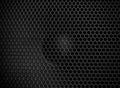 Protective decorative metal grill with honeycombs on modern acoustic systems. Music speakers close-up. Abstract background closeup Royalty Free Stock Photo