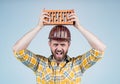 Protective equipment. mature builder in shirt. unshaven man on construction site. handsome building worker in hard hat Royalty Free Stock Photo