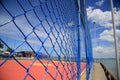 Protective fence on sports court Royalty Free Stock Photo