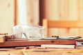 Protective goggles on carpentry woodwork workshop desk