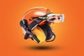Protective goggles for eyes and construction helmet for head with earmuffs and headlamp on a orange background. Construction tool Royalty Free Stock Photo