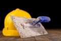 Protective helmet and tools for bricklayer. Work accessories for production workers Royalty Free Stock Photo