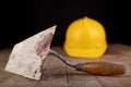 Protective helmet and tools for bricklayer. Work accessories for production workers