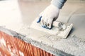 Protective material against water on house building. worker waterproofing cement Royalty Free Stock Photo