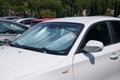 Protective reflective surface under windshield of car on hot day, heated by sun's rays inside car