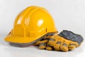 Protective safety helmet with durable leather gloves isolated on white background Royalty Free Stock Photo