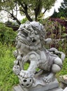 Protective stone chinese lion at front door of bud