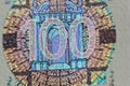 Protective watermark on a hundred euro bill in macro. protection against counterfeiting of banknotes. hologram. detail of paper Royalty Free Stock Photo