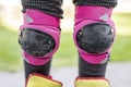 Protectors on teenage girl skateboard knee Royalty Free Stock Photo