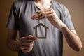 protects the house with his hands Royalty Free Stock Photo