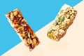 Protein bar with cereals on brown and blue background. Royalty Free Stock Photo