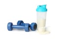 Protein powder, shaker and dumbbells isolated on white Royalty Free Stock Photo
