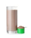 Protein shake in glass and scoop with powder Royalty Free Stock Photo