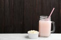 Protein shake and powder on white table Royalty Free Stock Photo