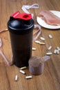 Protein shake, shaker and round scoop Royalty Free Stock Photo