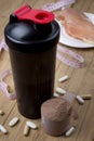 Protein shake, shaker and round scoop Royalty Free Stock Photo