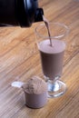 Protein shake, shaker and round scoop