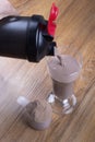 Protein shake, shaker and round scoop Royalty Free Stock Photo