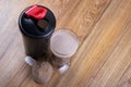 Protein shake, shaker and round scoop Royalty Free Stock Photo