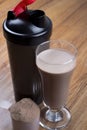 Protein shake, shaker and round scoop Royalty Free Stock Photo