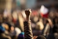 Protest against the government in Paris, France. Demonstrators raised their hands up, A raised fist of a protestor at a political