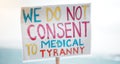 Protest, cardboard and sign for medical politics in street with march for vaccine law in society. Government, rally and Royalty Free Stock Photo