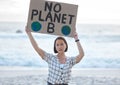 Protest, climate change and woman with a sign on the beach to stop pollution and global warming. Political, earth Royalty Free Stock Photo