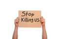 Protest poster with the message Stop Killing Us.