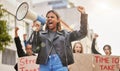 Protest, shouting and woman with megaphone in city marching for gender equality, justice and freedom. Demonstration