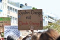 Protest sign saying `System change not climate change` held up by young people during Global Climate Strike Royalty Free Stock Photo