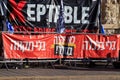 Protest signs during a demonstration against Israeli Prime Minister Benjamin Netanyahu, near his home on Balfour Street