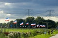 Protest signs and rows of flags upside down in Lekkerkerk along the N210 in the municipality of Krimpenerwaard