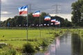 Protest signs and rows of flags upside down in Lekkerkerk along the N210 in the municipality of Krimpenerwaard