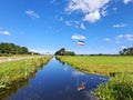 Protest signs and rows of flags upside down in Lekkerkerk along the N210 in the municipality of Krimpenerwaard