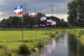 Protest signs and rows of flags upside down in Lekkerkerk along the N210 in the municipality of Krimpenerwaard