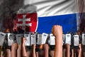 Protest in Slovakia - police special forces stand against the angry crowd on flag background, demonstration fighting concept,