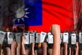 Protest in Taiwan Province of China - police squad stand against the angry crowd on flag background, demonstration stopping