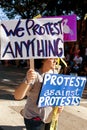 A Protester Against Protests Carries Signs In Oddball Miami Parade