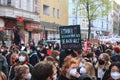 A protester holding a placecard saying `8 men own more than half the world`