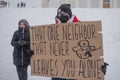 Protester holding poster on prostest against Russian agression. Helsinki, Finland, 7.02.2022