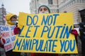 Protester holding poster on prostest against Russian agression. Helsinki, Finland, 7.02.2022