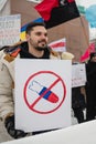 Protester holding poster in prostest against Russian agression. Helsinki, Finland, 7.02.2022