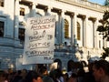 Protester holding a sign with a quote about injustice outside of the Fifth Circuit Court of Appeals