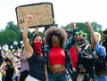 Protester holding sign at the UK Black Lives Matter protest at Hyde Park in London. Royalty Free Stock Photo