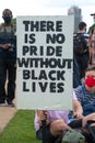 Protester holding sign at the UK Black Lives Matter protest at Hyde Park in London. Royalty Free Stock Photo