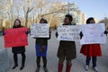 A protester holds a sign during a march against police brutality and grand jury decision on Eric Garner case on Grand Army Plaza