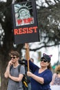 Protester holds a sign that reads, `Why Trump? RESIST`