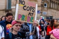 A protester holds up a sign at the Liverpool Pride march asking police to stay away